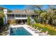 Beautiful backyard featuring a pool, lounge chairs, and a well-maintained garden area at 2629 Goldbug Ave, Sullivans Island, SC 29482
