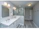 Bathroom with a double vanity, a glass enclosed shower, and modern lighting fixtures at 2629 Goldbug Ave, Sullivans Island, SC 29482