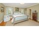 Inviting main bedroom featuring a well-lit space with natural light, wood floors, and a closet at 2629 Goldbug Ave, Sullivans Island, SC 29482
