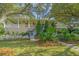 Charming home featuring a welcoming porch, beautiful landscaping, and a stone walkway leading to the entrance at 2629 Goldbug Ave, Sullivans Island, SC 29482