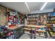 Organized garage space with tool storage, work bench, and visible lighting at 2629 Goldbug Ave, Sullivans Island, SC 29482