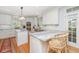Modern kitchen with stainless steel appliances, marble countertops, and ample cabinet space at 2629 Goldbug Ave, Sullivans Island, SC 29482