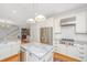 Gourmet kitchen featuring stainless steel appliances and a breakfast bar at 2629 Goldbug Ave, Sullivans Island, SC 29482