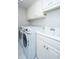 Convenient laundry room equipped with modern washer, dryer, and sink at 2629 Goldbug Ave, Sullivans Island, SC 29482