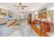 Bright living room showcasing hardwood floors, a fireplace, and a comfortable seating area at 2629 Goldbug Ave, Sullivans Island, SC 29482