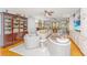 Elegant living room featuring a fireplace, built-in shelving, and comfortable seating arrangement at 2629 Goldbug Ave, Sullivans Island, SC 29482