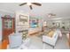 Cozy living room with fireplace, TV, built-in cabinets, and comfortable seating in an open layout at 2629 Goldbug Ave, Sullivans Island, SC 29482