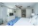 Bright main bedroom featuring a ceiling fan, closet and adjoining room with crib at 2629 Goldbug Ave, Sullivans Island, SC 29482