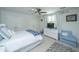 Spacious main bedroom featuring a ceiling fan, natural light, and stylish decor at 2629 Goldbug Ave, Sullivans Island, SC 29482
