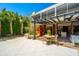Inviting outdoor patio features tiled flooring, a dining table, and access to the home's interior at 2629 Goldbug Ave, Sullivans Island, SC 29482