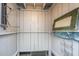 Inviting outdoor shower featuring vintage decor, a wooden bench, and practical shelving at 2629 Goldbug Ave, Sullivans Island, SC 29482