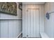 Well-equipped outdoor shower with shelving, bench, and an art piece adds character at 2629 Goldbug Ave, Sullivans Island, SC 29482