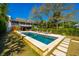 Beautiful pool area with a landscaped yard, perfect for relaxation and outdoor entertainment at 2629 Goldbug Ave, Sullivans Island, SC 29482