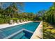 A well-maintained pool offers a refreshing escape, complemented by a manicured lawn and greenery at 2629 Goldbug Ave, Sullivans Island, SC 29482
