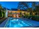 Exterior view of a backyard pool with lounge chairs and access to the home's patio at 2629 Goldbug Ave, Sullivans Island, SC 29482