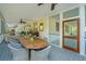 Charming screened porch with outdoor dining and a view connecting to an entertainment area at 2629 Goldbug Ave, Sullivans Island, SC 29482