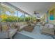 Cozy porch featuring comfortable seating, a fireplace, and scenic views, perfect for relaxing and entertaining at 2629 Goldbug Ave, Sullivans Island, SC 29482