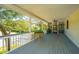 Serene porch featuring wooden floors and plenty of room for seating, perfect for enjoying outdoor living at 2629 Goldbug Ave, Sullivans Island, SC 29482