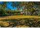 Expansive grassy yard with mature trees, offering ample space for outdoor activities and relaxation at 2629 Goldbug Ave, Sullivans Island, SC 29482