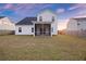 View of the back of the house with a screen porch and green lawn at 265 Lucca Dr, Summerville, SC 29486
