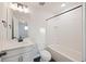 Clean bathroom featuring white fixtures, black hardware, and a shower/tub combo at 265 Lucca Dr, Summerville, SC 29486