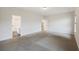 Spacious bedroom with neutral carpet, ensuite bath, and a walk-in closet offer comfort and convenience at 265 Lucca Dr, Summerville, SC 29486