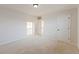 Neutral bedroom with plush carpet, recessed lighting, and multiple doors at 265 Lucca Dr, Summerville, SC 29486
