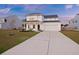 Beautiful two-story home featuring a well-manicured lawn and a two-car garage at 265 Lucca Dr, Summerville, SC 29486