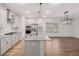 Modern kitchen with a large island, stainless steel appliances, and light gray cabinets and countertops at 265 Lucca Dr, Summerville, SC 29486