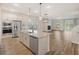 Modern kitchen with stainless steel appliances, an island, and an open floor plan at 265 Lucca Dr, Summerville, SC 29486