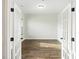 Open office space with white French doors and hardwood floors at 265 Lucca Dr, Summerville, SC 29486
