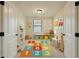 Fun playroom with colorful rug, shelving, table with chairs, and playful decor at 265 Lucca Dr, Summerville, SC 29486