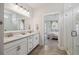 Bright bathroom with double vanity and tile flooring, adjacent to a bedroom at 2743 Calico Bass Ln, Johns Island, SC 29455