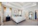 Bright bedroom features an ensuite bathroom, and stylish window decor at 2743 Calico Bass Ln, Johns Island, SC 29455