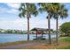 Scenic view of a community lake featuring a canoe storage rack along the water's edge at 2743 Calico Bass Ln, Johns Island, SC 29455