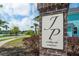 Elegant community sign for 'at Whitney Lake by Sabal Homes' surrounded by lush landscaping and charming homes at 2743 Calico Bass Ln, Johns Island, SC 29455