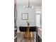 Dining nook with a round marble table, black chairs, and a modern chandelier at 2743 Calico Bass Ln, Johns Island, SC 29455