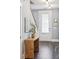 Bright entryway features stylish decor, wood floors, and a staircase, creating a welcoming first impression at 2743 Calico Bass Ln, Johns Island, SC 29455