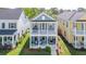 Two-story home boasts a charming double porch, set amid beautifully landscaped lawns and mature trees at 2743 Calico Bass Ln, Johns Island, SC 29455