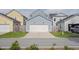 Detached two-car garage with a clean white door and driveway, providing secure parking and curb appeal at 2743 Calico Bass Ln, Johns Island, SC 29455