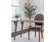 Bright home office with a rustic desk, chair and plant accents at 2743 Calico Bass Ln, Johns Island, SC 29455