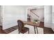Open home office with stylish wainscoting and entry to the staircase at 2743 Calico Bass Ln, Johns Island, SC 29455