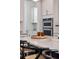 Kitchen with stainless steel appliances, double ovens, and an island with seating at 2743 Calico Bass Ln, Johns Island, SC 29455