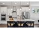 Contemporary kitchen featuring stainless steel appliances, white cabinetry, and a large island with seating at 2743 Calico Bass Ln, Johns Island, SC 29455