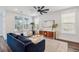 Bright living room featuring a ceiling fan, hardwood flooring, and comfortable seating at 2743 Calico Bass Ln, Johns Island, SC 29455