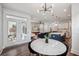 Open concept living space with French doors, kitchen island, and modern living room at 2743 Calico Bass Ln, Johns Island, SC 29455