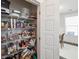 Pantry with shelving stocked with food items and household supplies at 2743 Calico Bass Ln, Johns Island, SC 29455