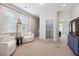 Relaxing sitting room with modern chairs, laundry room access, and lots of light at 2743 Calico Bass Ln, Johns Island, SC 29455
