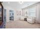 Bright sitting room with modern chairs, neutral decor, and lots of natural light at 2743 Calico Bass Ln, Johns Island, SC 29455