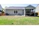 Backyard with a screened-in porch, patio area, grassy lawn, and wooden fence at 2914 Glenarden Dr, Charleston, SC 29414